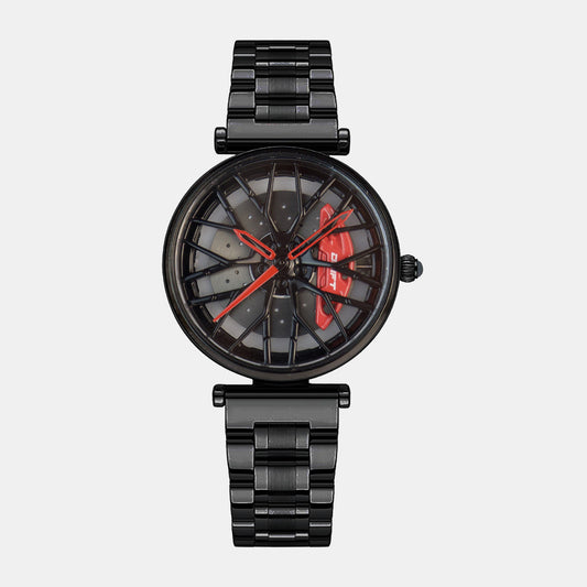 The image showcases a women's motorsport-inspired watch from DriftElement, featuring a black rim-design dial with prominent red watch hands. This innovative design from the German startup combines the essence of car rims with the functionality of a timepiece, resulting in a bold and stylish accessory for those with a passion for cars and fashion. The watch has a matching black metal bracelet, completing its sleek and modern aesthetic.#id_47362139849034